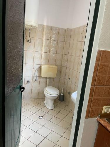 a bathroom with a toilet and a sink at Sea flavor in Shëngjin