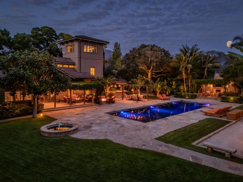 a backyard with a swimming pool and a house at Sea Ranch by Paradise Retreats in Montecito
