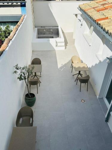 a hallway with chairs and tables in a building at 27 côté remparts in Aigues-Mortes
