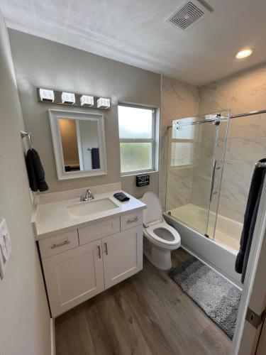 a bathroom with a toilet and a shower and a sink at Venice Florida near beach in Venice