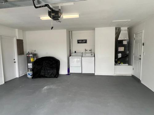 an empty living room with a washer and dryer at Venice Florida near beach in Venice