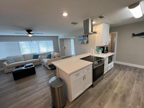 a kitchen and living room with a couch and a table at Venice Florida near beach in Venice