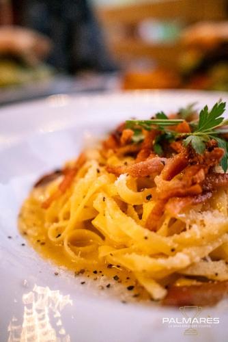 a plate of pasta on a white plate at Hôtel Palmarès Spa in Spa