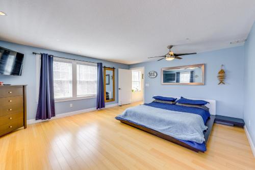 a bedroom with blue walls and a bed with blue sheets at Steps to Short Sand Beach Retreat with Game Room! in York