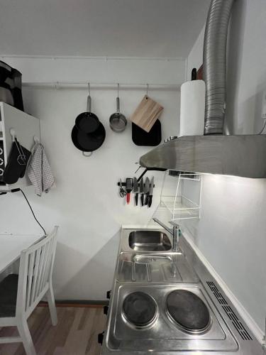 a kitchen with a sink and a stove in it at Studio Apartment in Airport Area in Copenhagen