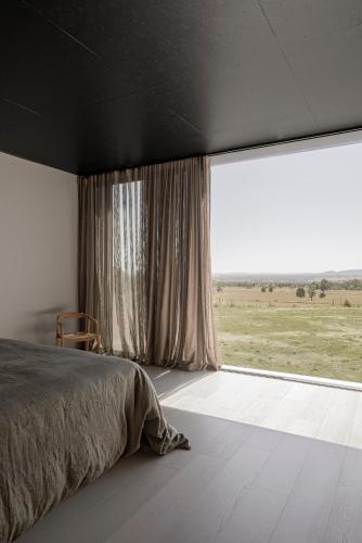 Ένα ή περισσότερα κρεβάτια σε δωμάτιο στο Zensi Retreat - House