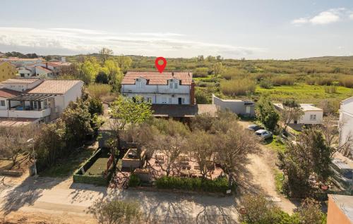 an aerial view of a house with a red sign on it at Awesome Home In Povljana With Wifi in Povljana