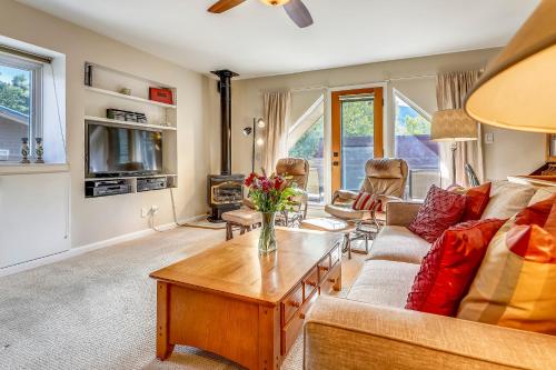 a living room with a couch and a table at Aspen Townhome with Deck - Restaurant Row in Aspen