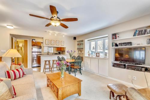 a living room with a couch and a ceiling fan at Aspen Townhome with Deck - Restaurant Row in Aspen