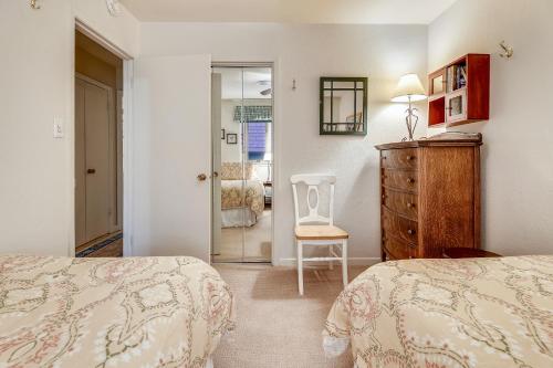 a bedroom with two beds and a chair and a dresser at Aspen Townhome with Deck - Restaurant Row in Aspen