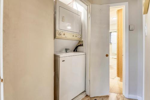 a white laundry room with a washer and dryer at Aspen Townhome with Deck - Restaurant Row in Aspen