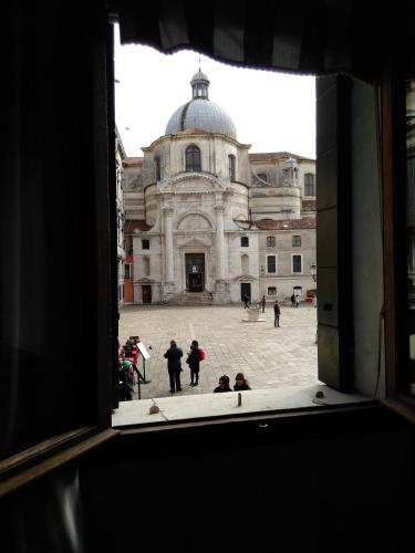 a view of a building from a window at Albergo Al Gobbo in Venice