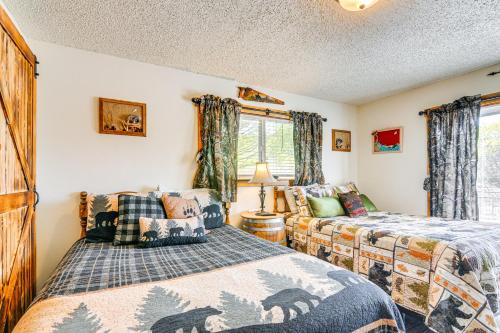 a bedroom with two beds and a window at Hot Tub and Yard Wills Place Utah Family Getaway in Glendale