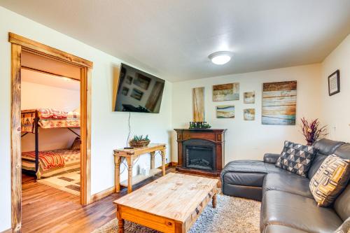 a living room with a couch and a fireplace at Hot Tub and Yard Wills Place Utah Family Getaway in Glendale