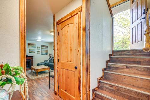 a hallway with a wooden door and stairs at Hot Tub and Yard Wills Place Utah Family Getaway in Glendale