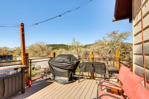 a deck with two chairs and a tent on it at Hot Tub and Yard Wills Place Utah Family Getaway in Glendale