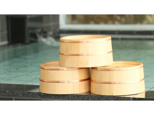 a stack of wooden bowls sitting on a counter at Hotel AreaOne Chitose - Vacation STAY 96133v in Chitose
