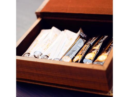 a wooden box filled with lots of books at Hotel AreaOne Chitose - Vacation STAY 96133v in Chitose