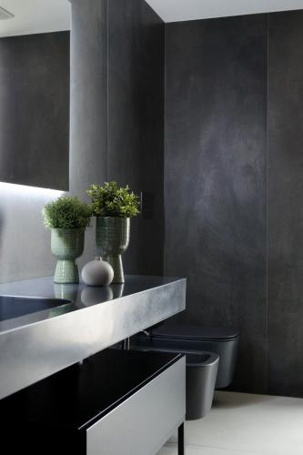 a bathroom with two vases with plants on a counter at Civico Savoia Apartment in Rosolini