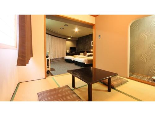 เตียงในห้องที่ Hotel AreaOne Chitose - Vacation STAY 96140v