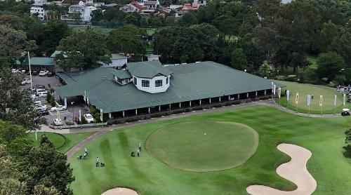an aerial view of a house with a golf course at Colombo Green Heaven in Cotta Road Railroad Station