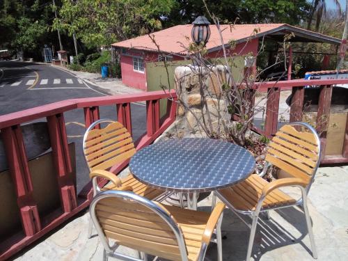 a table and chairs sitting on a balcony at Hotel Contadora in Contadora