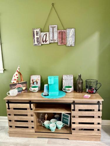 a wooden table with items on top of it at Duplex style home-quiet area in Warner Robins