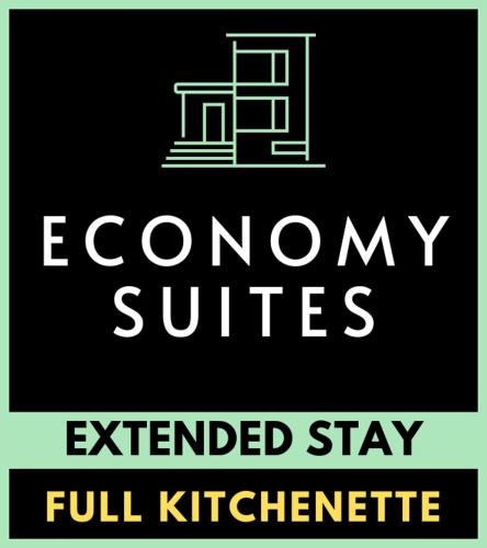 a sign with the words economy suites full kichenerate at Economy Suites Extended Stay in Tulsa