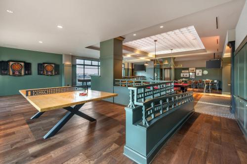 a dining room with a ping pong table at Omni Interlocken Hotel in Broomfield