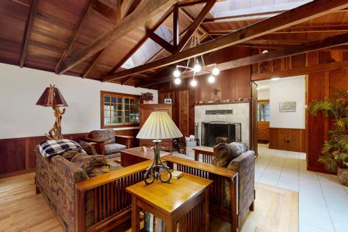a living room with two couches and a table at Little River Redwoods in Little River