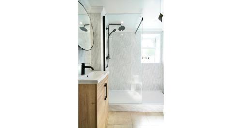 a bathroom with a shower and a sink at Joannes Retreat, Dog Friendly Property in Weymouth with Free Parking in Weymouth