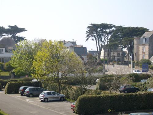 a group of cars parked in a parking lot at Grand studio lumineux ,centre ville, grande plage,Quiberon IZE1UU in Quiberon