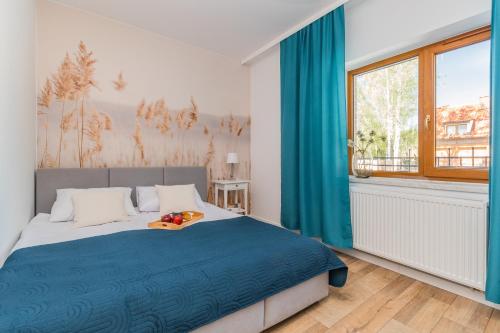 Postel nebo postele na pokoji v ubytování Apartamenty nad morzem Mierzeja Wiślana Mikoszewo