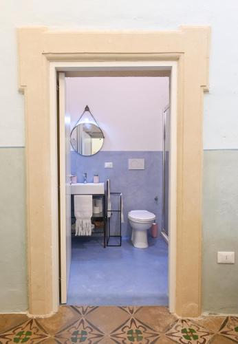 a bathroom with a toilet and a sink at Dimora S.Vito in Lequile