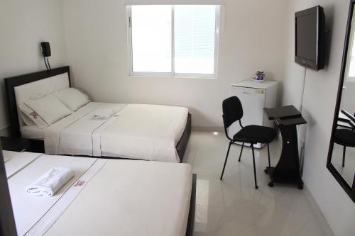 Postel nebo postele na pokoji v ubytování hotel royal fenix