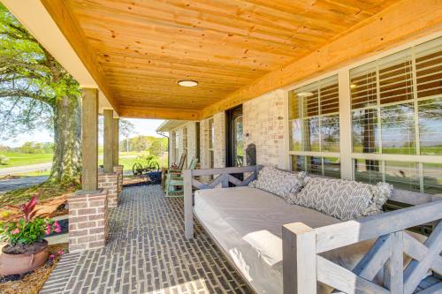 a porch with a couch on a house at Great Outdoor Space Margys Farmhouse in Jasper in Jasper
