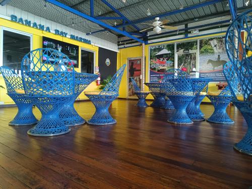 a group of blue vases sitting on a wooden floor at Banana Bay Marina in Golfito