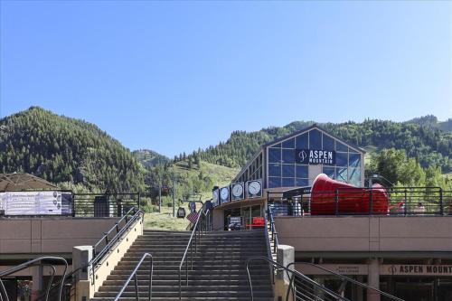 a building with stairs in front of a ski resort at Lovely Aspen Condo with Mountain Views & Hot Tub in Aspen