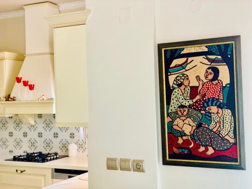 a painting on the wall of a kitchen at Astali Villa in Stalida