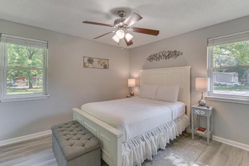 a bedroom with a bed and a ceiling fan at 11 Mi to Beaches Peaceful Foley Home with Yard in Foley