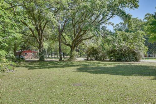 a park with trees and a field of grass at 11 Mi to Beaches Peaceful Foley Home with Yard in Foley