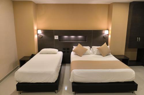 Hotel Quarta Avenidaにあるベッド