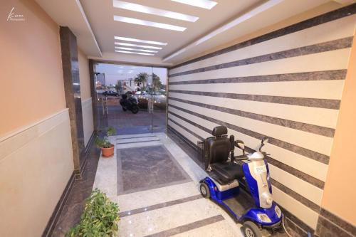 a scooter parked in a hallway of a building at Andalusia Blue Beach Hurghada in Hurghada