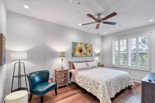 a bedroom with a bed and a ceiling fan at Moorings 107 in Jekyll Island