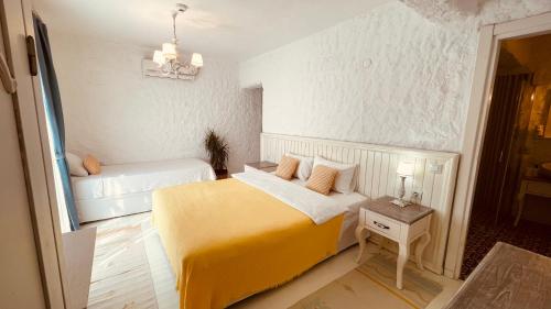 Ένα ή περισσότερα κρεβάτια σε δωμάτιο στο Mina Otel by Adda Alaçatı