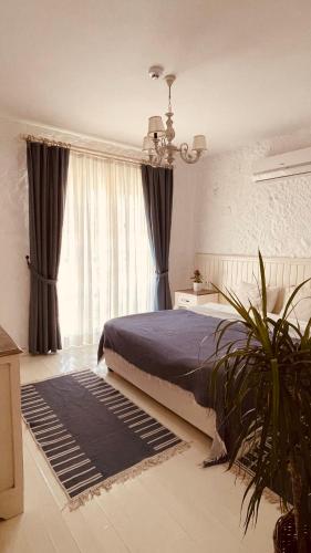 Ένα ή περισσότερα κρεβάτια σε δωμάτιο στο Mina Otel by Adda Alaçatı