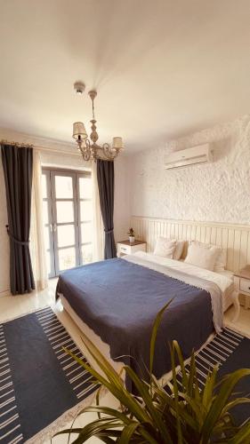 Ένα ή περισσότερα κρεβάτια σε δωμάτιο στο Mina Otel by Adda Alaçatı