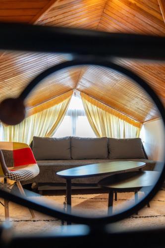 a view of a living room with a couch and a table at Sofita Ioannina Eleousa in Eleoúsa