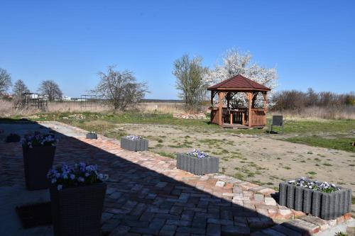 a park with a gazebo and a playground at Lawendowa Przystań - Dolina Baryczy in Ujeździec Mały