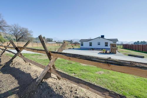 a wooden fence in front of a house at 19 Mi to Sequoia Natl Park Mtn-View Woodlake Gem in Woodlake